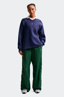 NIKE PANTALON PARACHUTE - MUJER