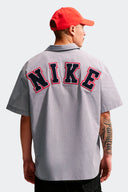 NIKE CAMISETA BUTTOM