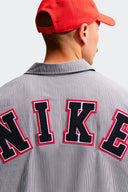 NIKE CAMISETA BUTTOM