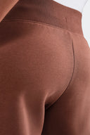 NIKE PANTALON PHOENIX MARRON - MUJER